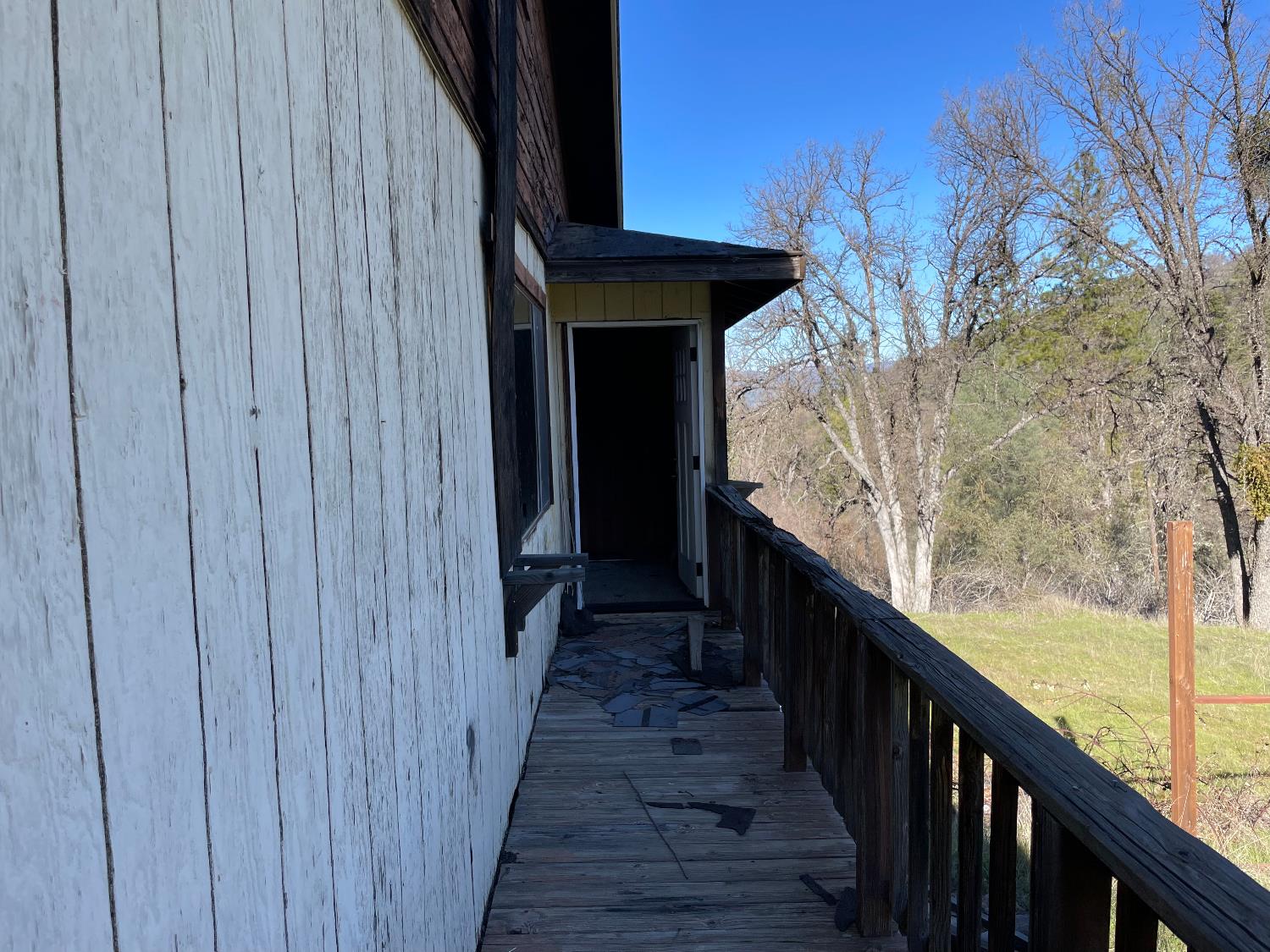 5723 Colorado Road Mariposa, CA 95338 - Photo 9 of 28 a view of a balcony with wooden floor and stairs