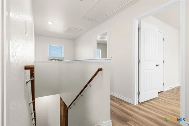 a view of entryway with wooden floor