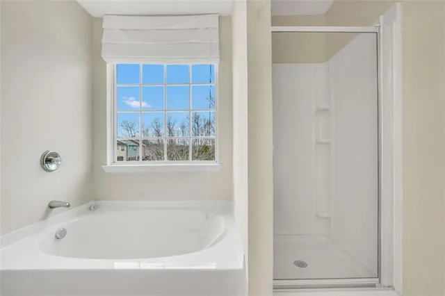 a white bath tub sitting next to a window