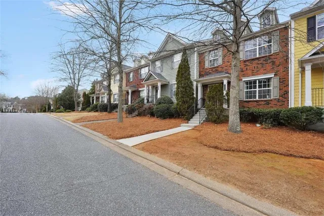 a front view of a building with a yard