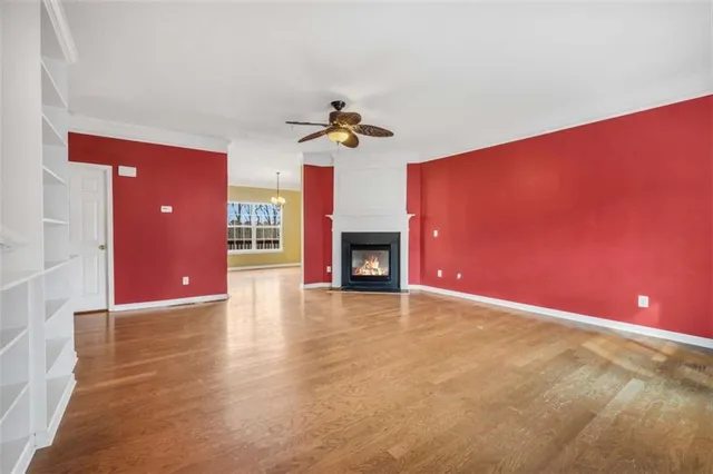 a view of a livingroom with a fireplace and a chandelier
