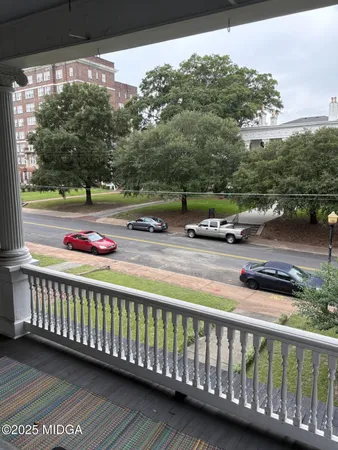 a view of street with wooden deck