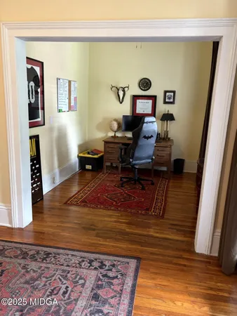 a living room with furniture and a rug