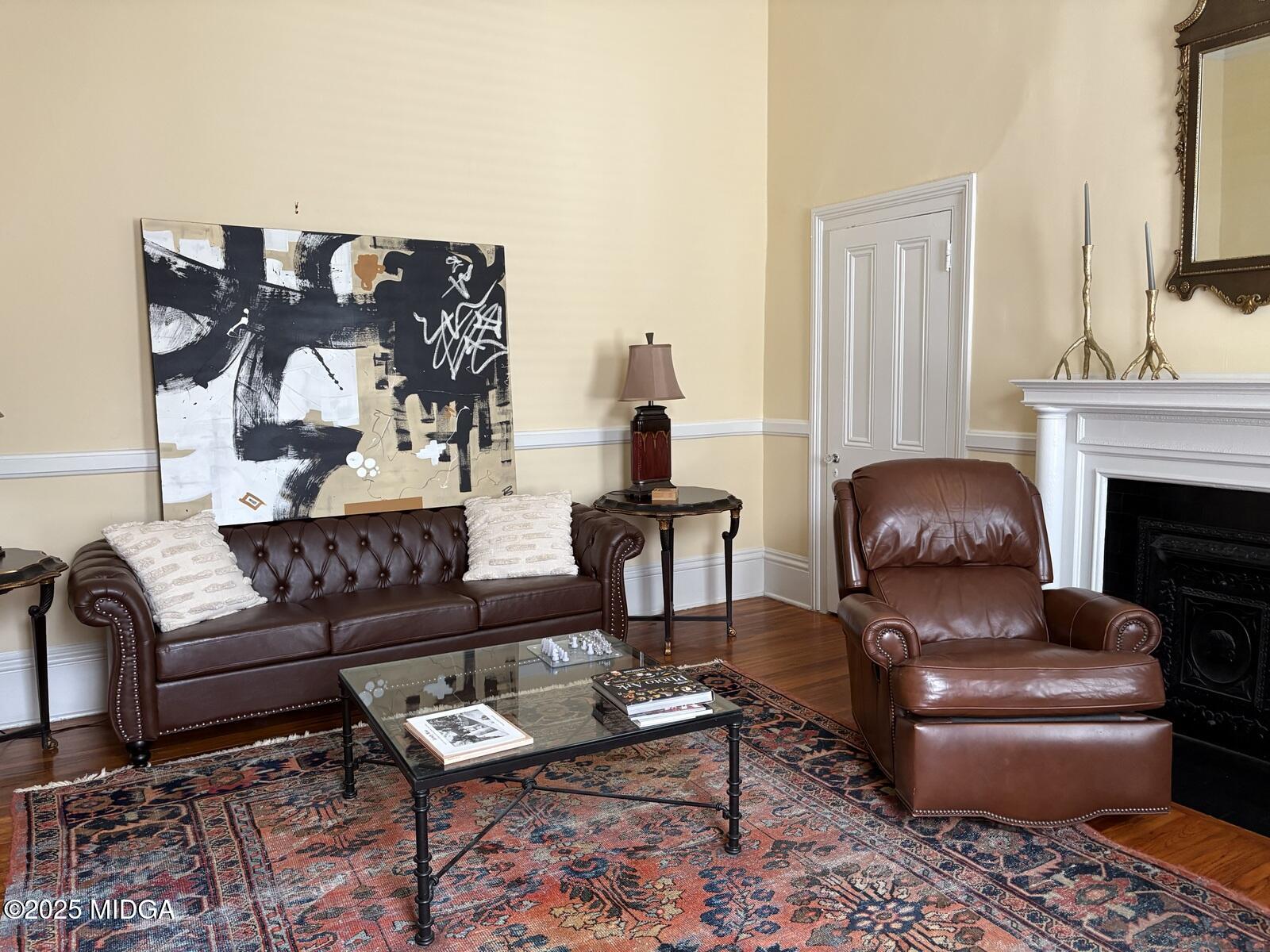 312 College Street, Unit 3 Macon, GA 31201 - Photo 10 of 24 a living room with furniture and a fireplace