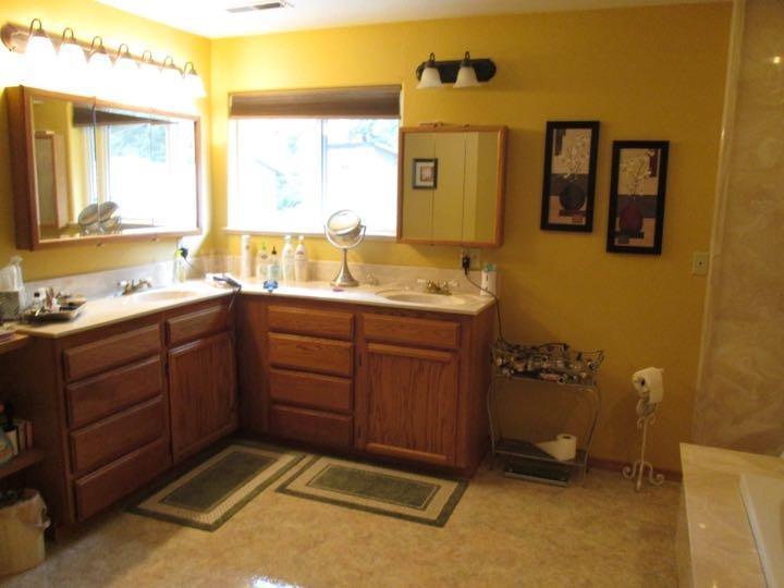 4419 Old Stage Road Central Point, OR 97502 - Photo 12 of 12 a spacious bathroom with a granite countertop sink mirror and a
