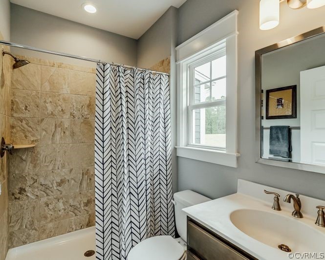 9112 Copplestone Road Chesterfield, VA 23832 - Photo 13 of 20 a bathroom with a sink and a mirror