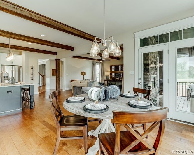 9112 Copplestone Road Chesterfield, VA 23832 - Photo 10 of 20 a view of a dining room with furniture and chandelier