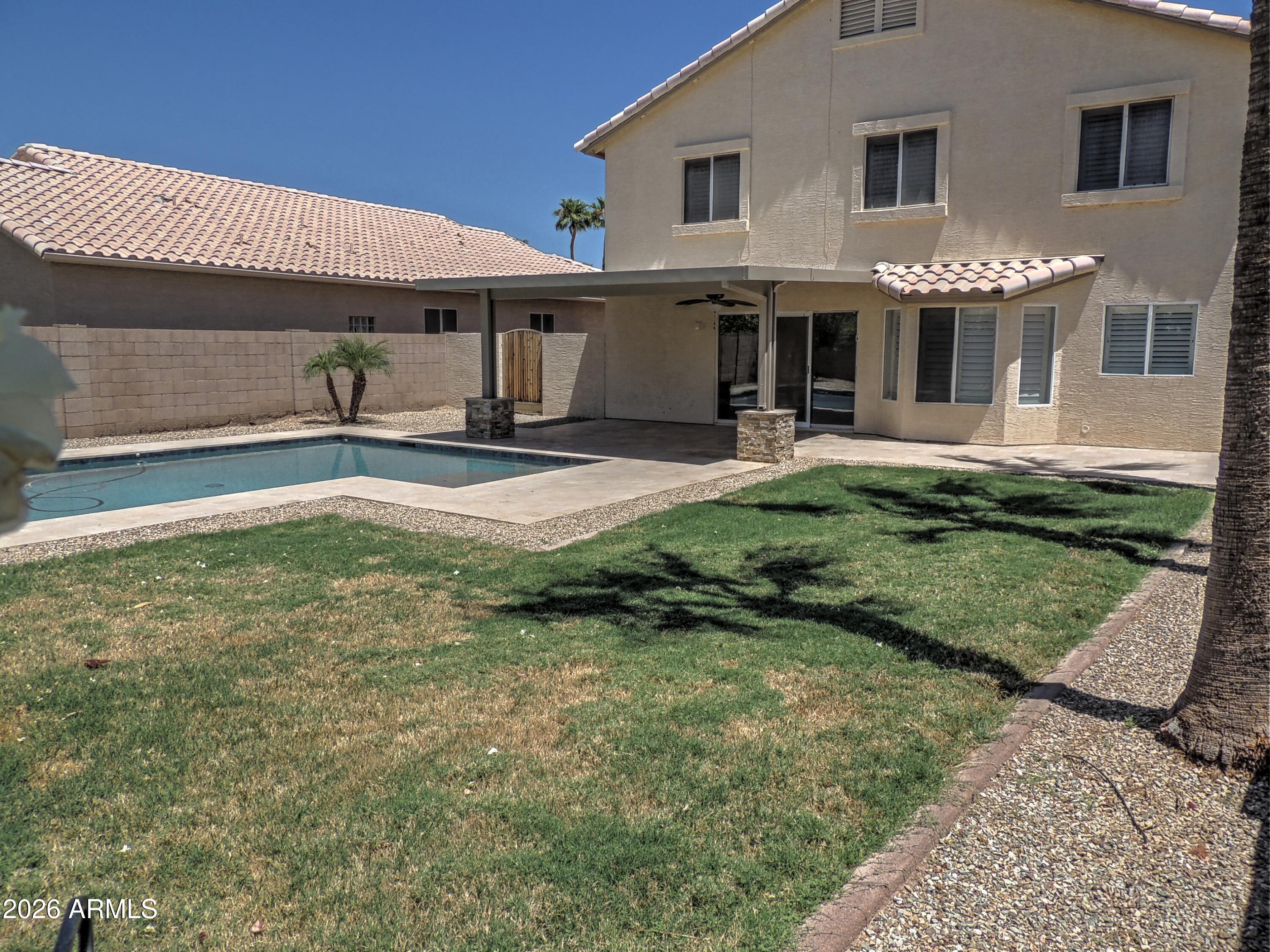 4409 East Dry Creek Road Phoenix, AZ 85044 - Photo 27 of 34 a view of a house with backyard and porch