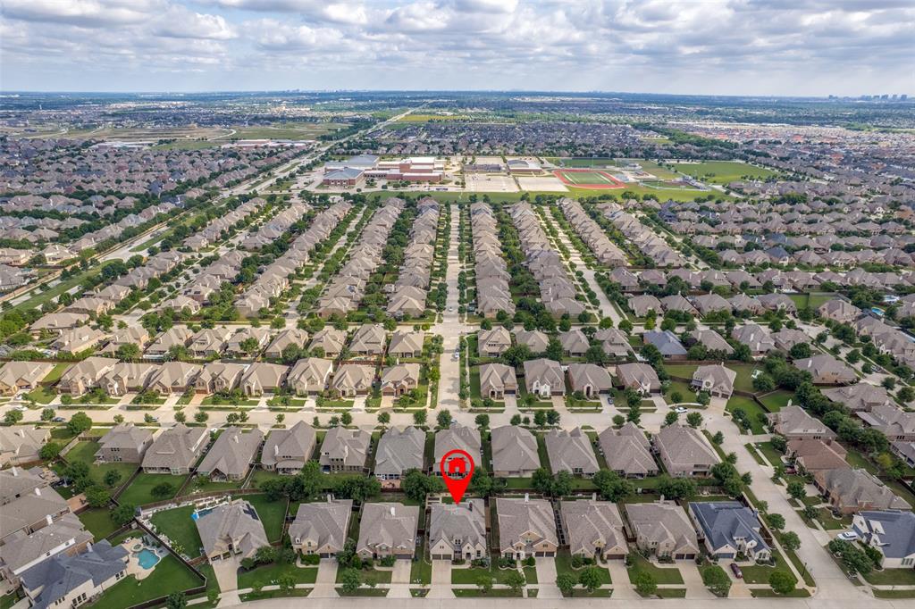 14215 Raspberry Lane Frisco, TX 75035 - Photo 30 of 30 Aerial perspective showcasing a residential development with uniform detached homes, a sports complex featuring multiple fields, and a large institutional building