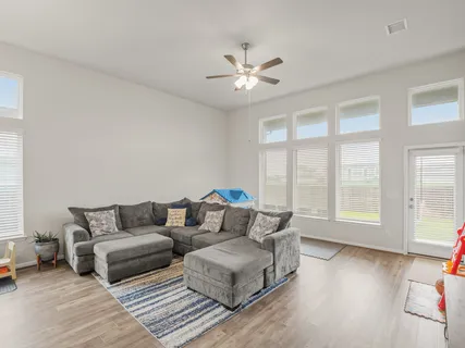 a living room with furniture and a large window