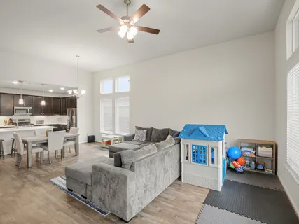 a living room with furniture and a large window