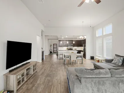 a living room with furniture and a flat screen tv