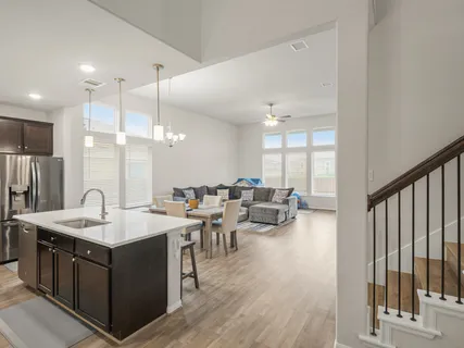 a large kitchen with a large island in the center