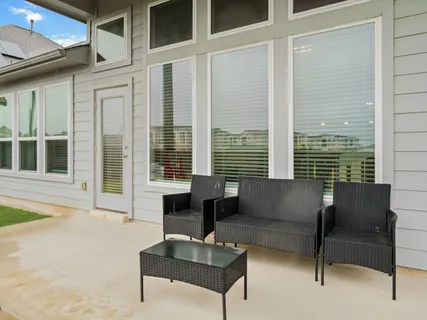 a outdoor living space with furniture and a window