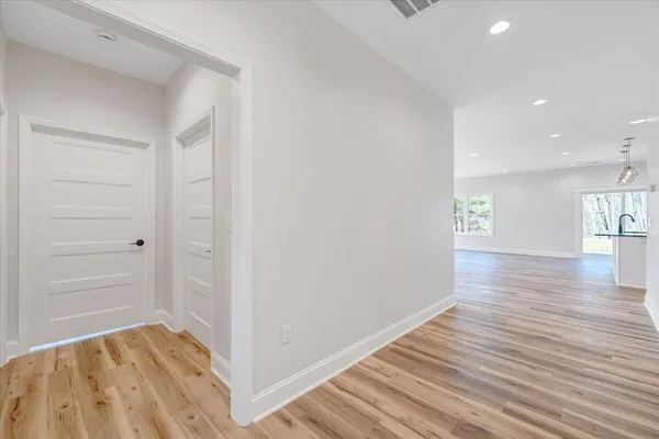 a view of a kitchen with microwave and cabinets