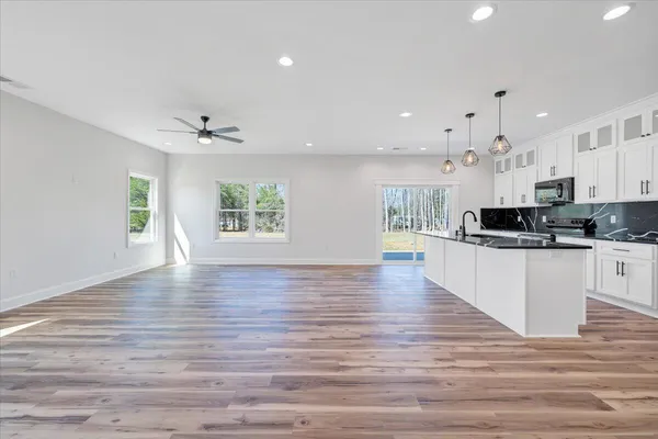 a view of a dining room and livingroom view with kitchen island furniture