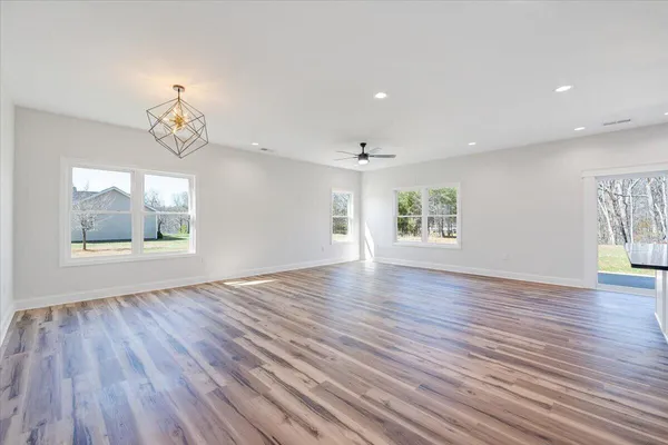 a kitchen with stainless steel appliances granite countertop a sink and a stove