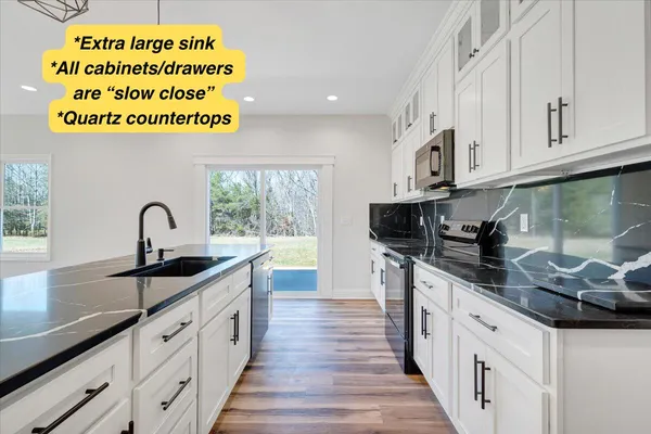 a sink sitting next to a window