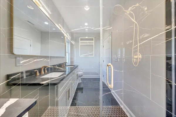 an aerial view of a house with a yard big trees