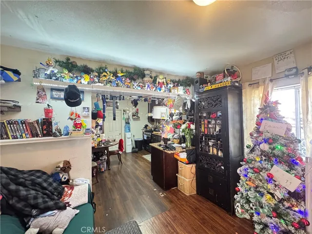 a view of a dining room with furniture and toys