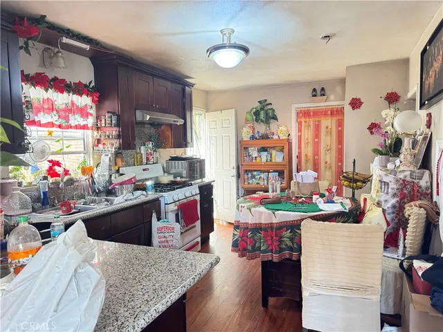 a kitchen filled with a table and chairs