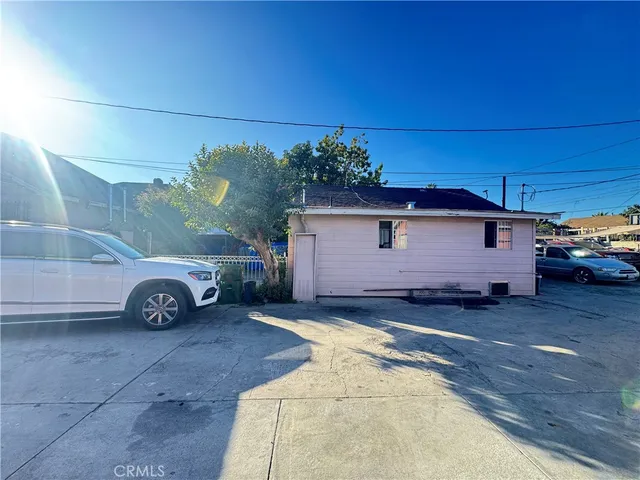 a view of a car is parked in front of house