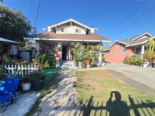 a front view of a building with garden