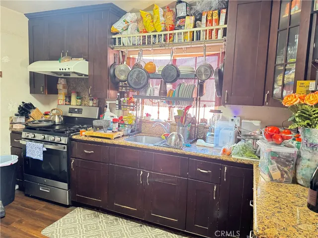 a kitchen with a sink and a stove