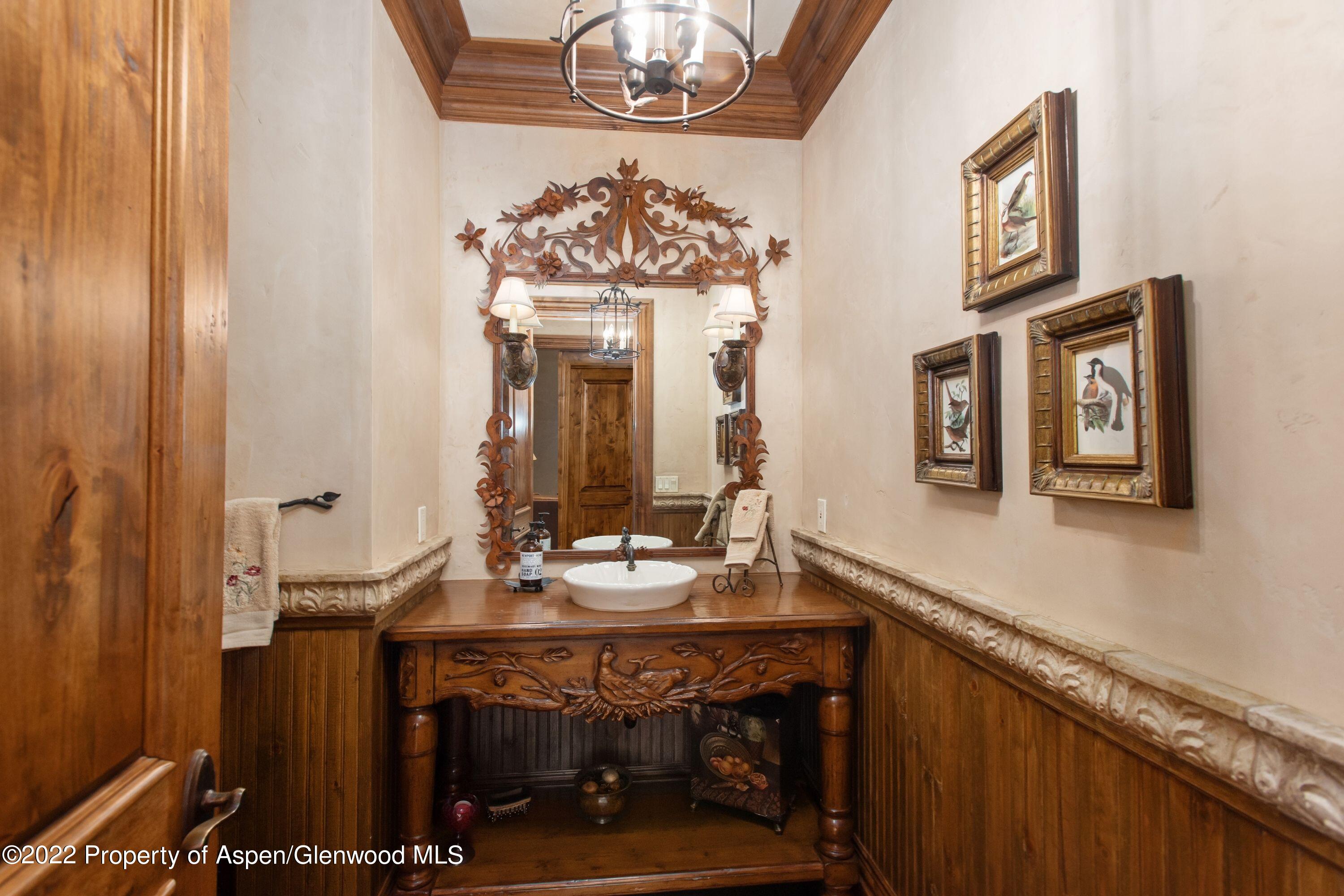 64 Spruce Ridge Lane Snowmass Village, CO 81615 - Photo 13 of 37 a view of a dining room with furniture and a chandelier