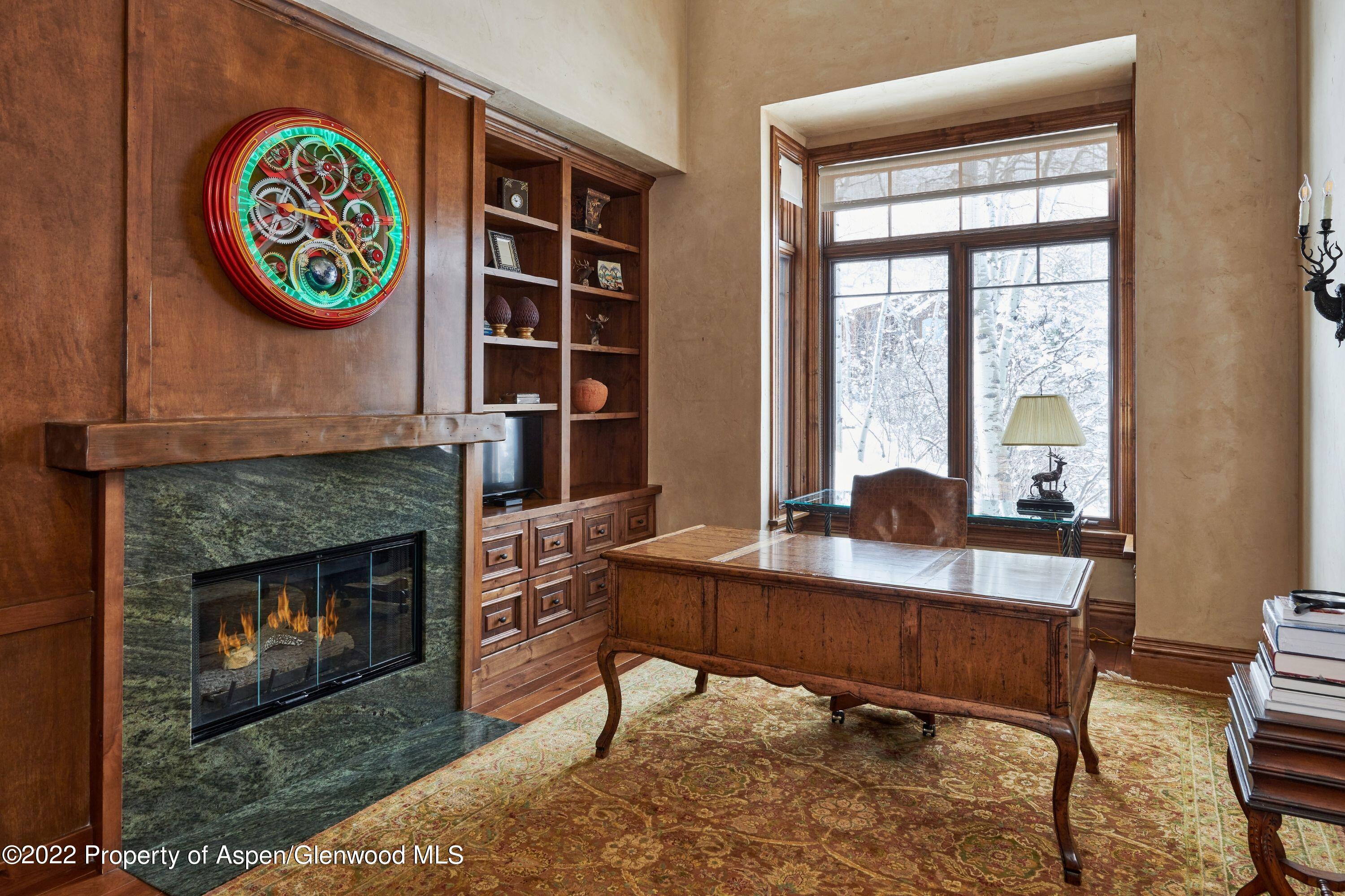 64 Spruce Ridge Lane Snowmass Village, CO 81615 - Photo 21 of 37 a workspace with furniture and a fireplace
