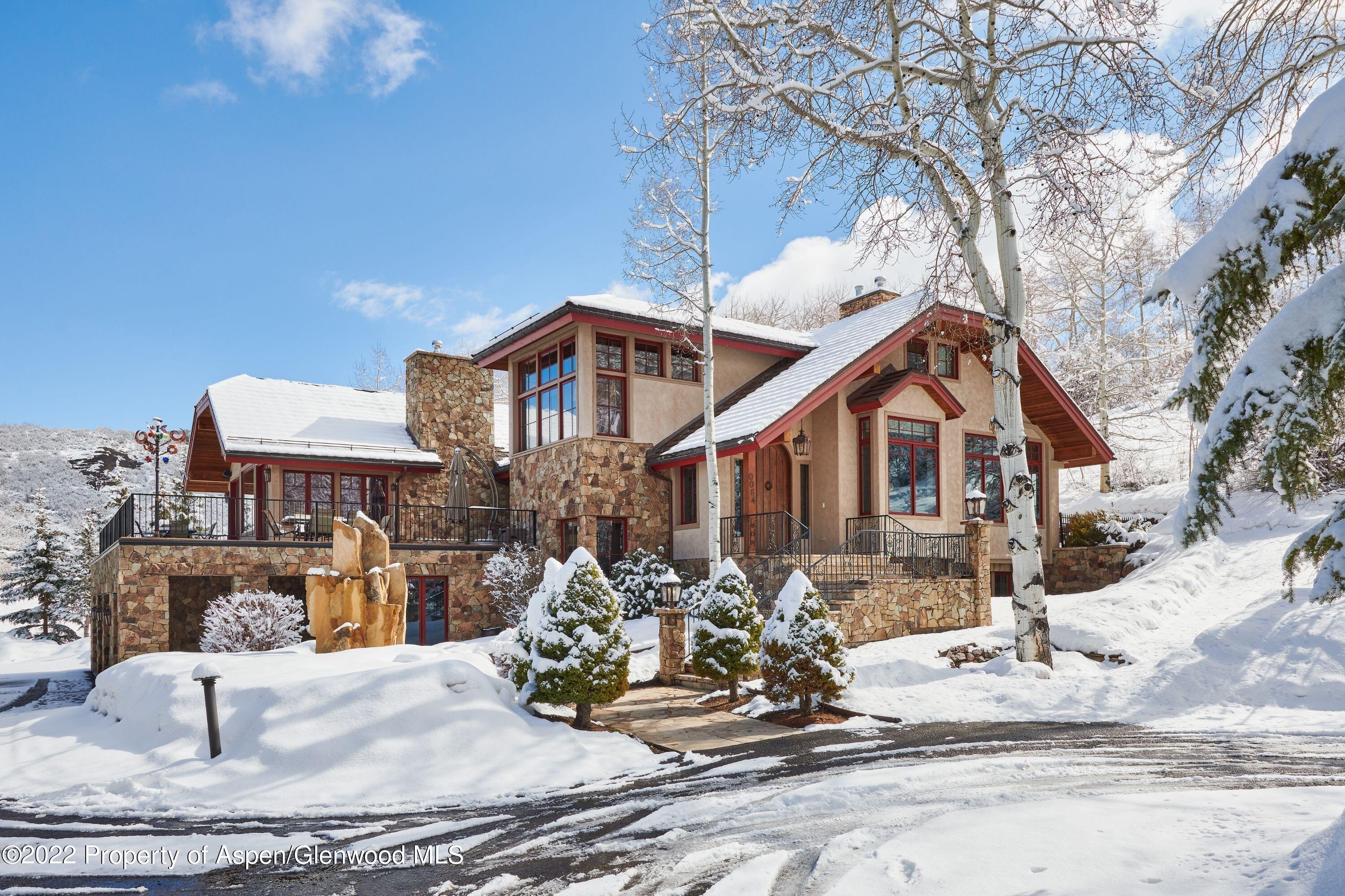 64 Spruce Ridge Lane Snowmass Village, CO 81615 - Photo 28 of 37 a front view of a house with a yard