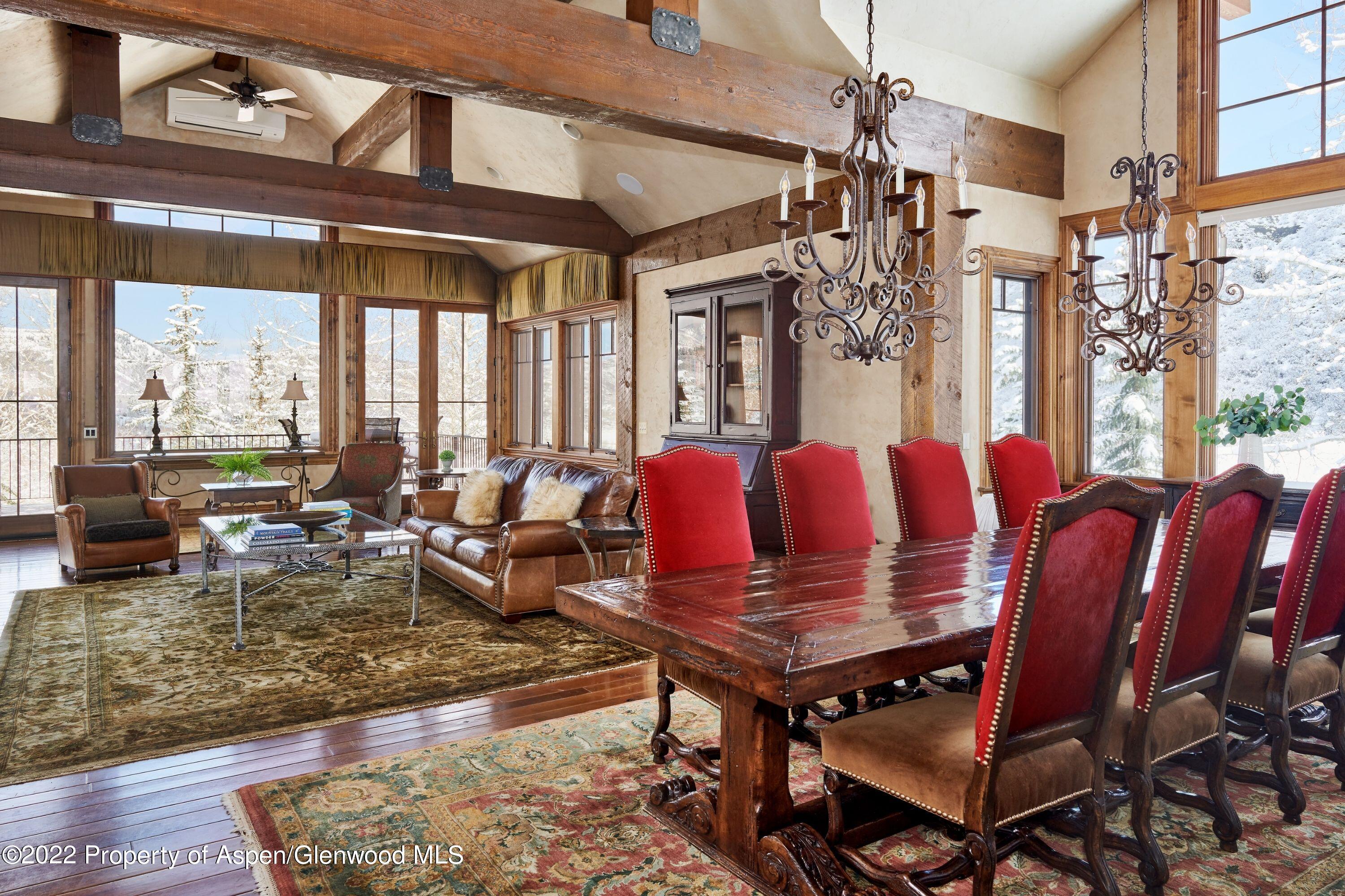 64 Spruce Ridge Lane Snowmass Village, CO 81615 - Photo 4 of 37 a living room with furniture and a large window