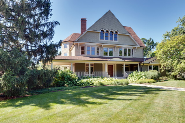 a front view of a house with a garden and plants