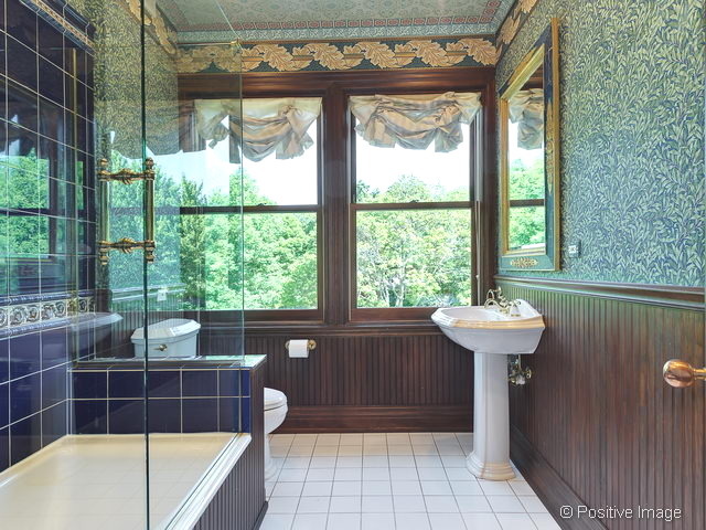106 East 8th Street Hinsdale, IL 60521 - Photo 11 of 24 a bathroom with a sink a bathtub and window