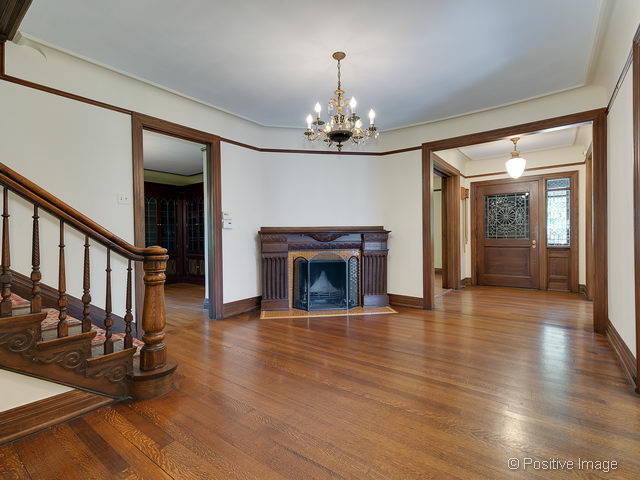 106 East 8th Street Hinsdale, IL 60521 - Photo 12 of 24 wooden floor fireplace and windows in an empty room