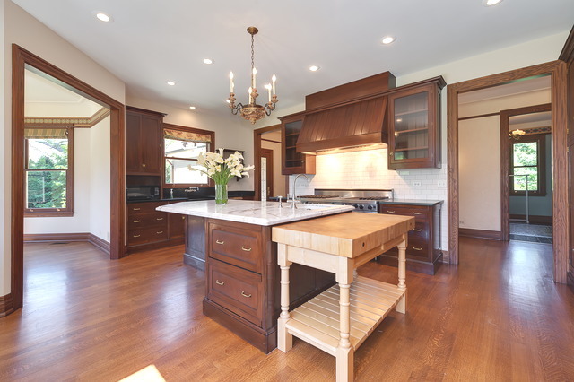 106 East 8th Street Hinsdale, IL 60521 - Photo 4 of 24 a large kitchen with stainless steel appliances a stove a sink a refrigerator and a dining table with wooden floor