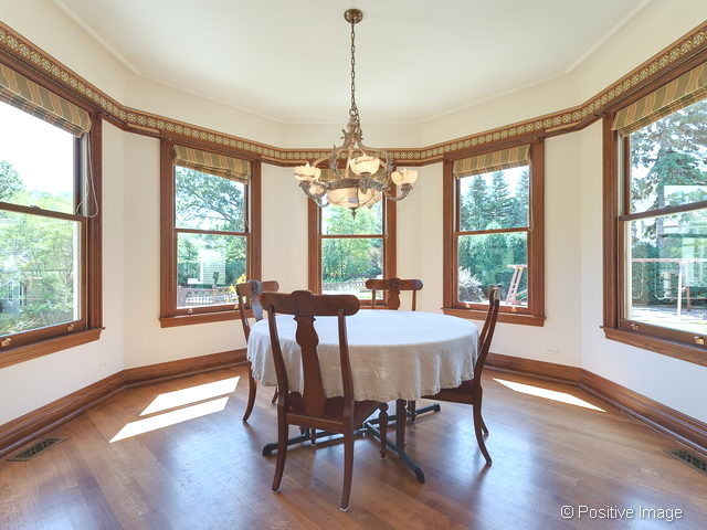 106 East 8th Street Hinsdale, IL 60521 - Photo 6 of 24 a view of a dining room with furniture window and wooden floor