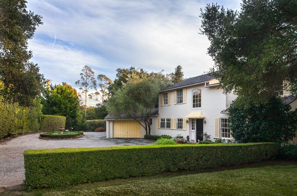 677 El Bosque Road Santa Barbara, CA 93108 - Photo 3 of 14 a front view of a house with a garden and a fire pit