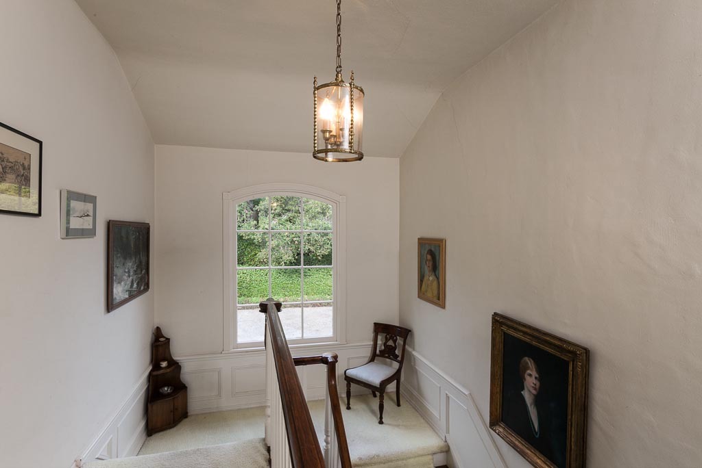 677 El Bosque Road Santa Barbara, CA 93108 - Photo 9 of 14 a view of a livingroom with furniture a chandelier and wooden floor