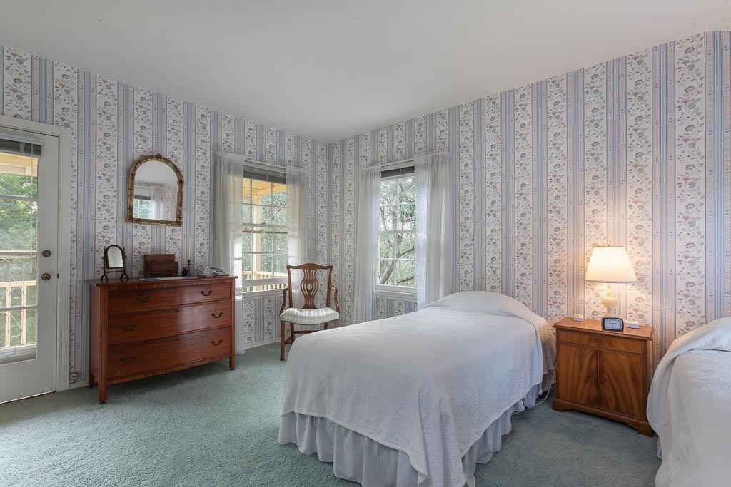 677 El Bosque Road Santa Barbara, CA 93108 - Photo 10 of 14 a bedroom with a bed and a dresser next to a window