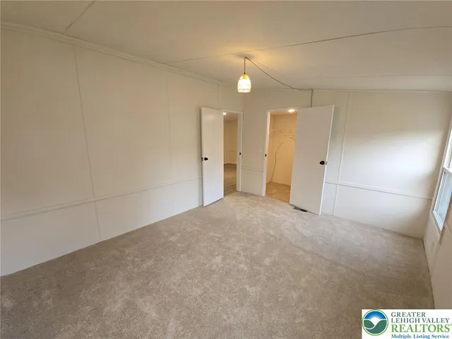 an empty room with a bathroom