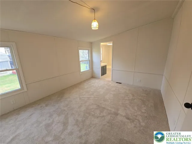 a white toilet sitting next to a bathroom sink and tub