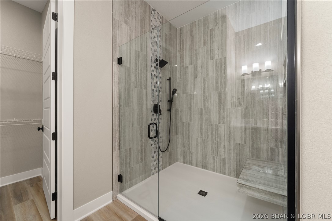 1184 Jeffries Road, Unit 519 Osage Beach, MO 65065 - Photo 11 of 58 The center stonework around the shower head adds a