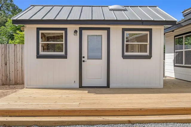 a view of front door with wooden floor