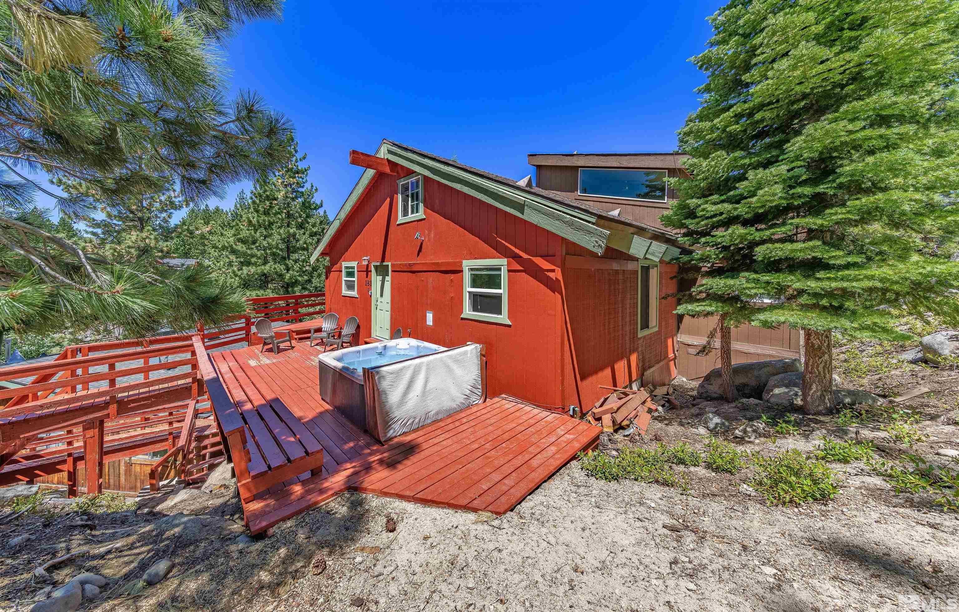 181 Tramway Drive, Unit B Stateline, NV 89449 - Photo 24 of 27 a view of a chairs and table in the backyard