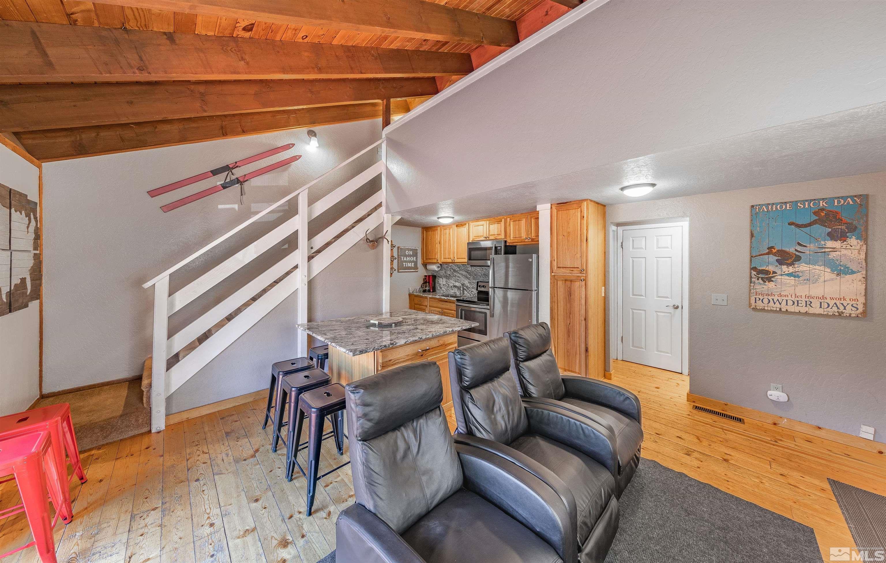 181 Tramway Drive, Unit B Stateline, NV 89449 - Photo 4 of 27 a living room with furniture and a rug