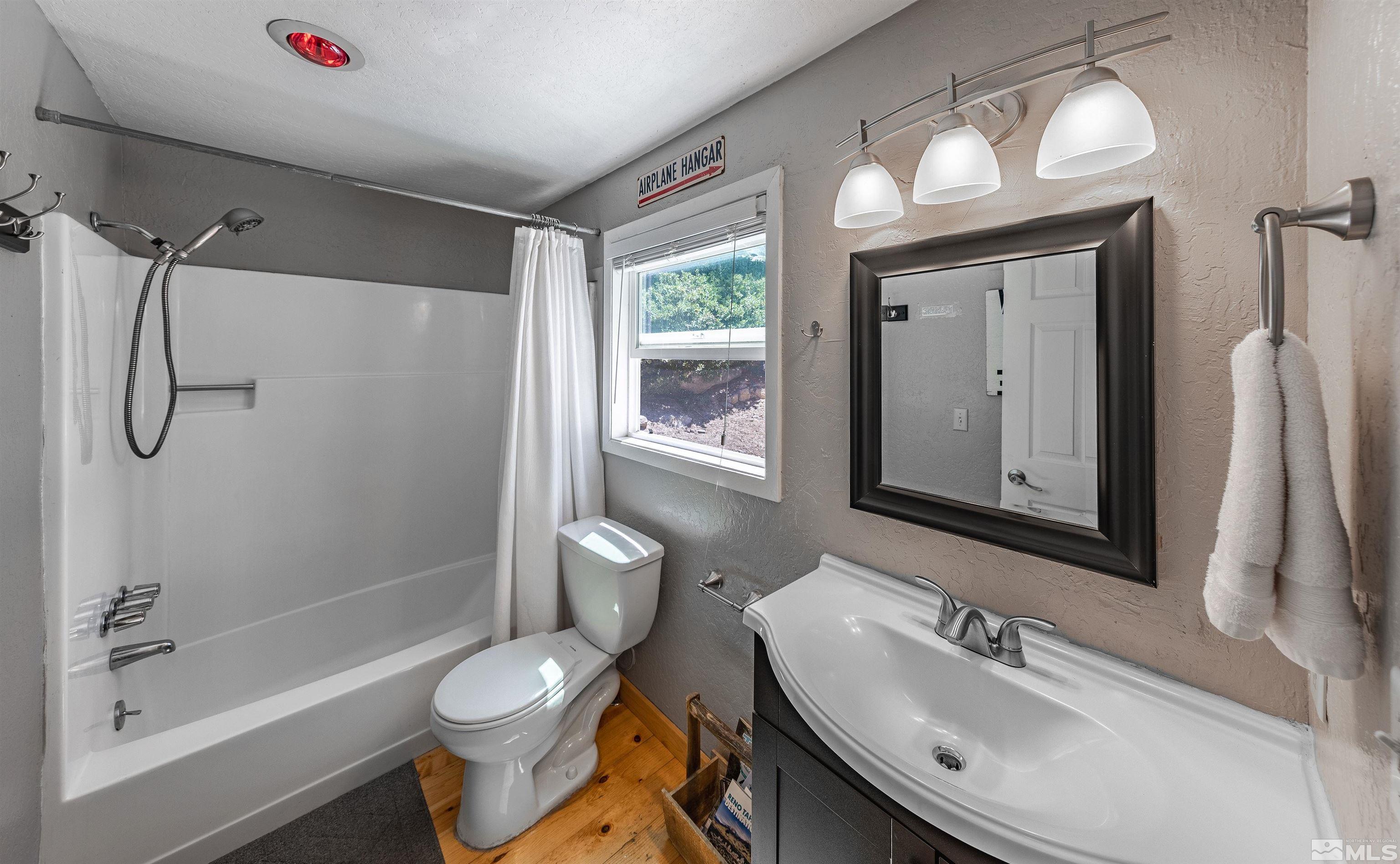 181 Tramway Drive, Unit B Stateline, NV 89449 - Photo 10 of 27 a bathroom with a sink toilet and shower