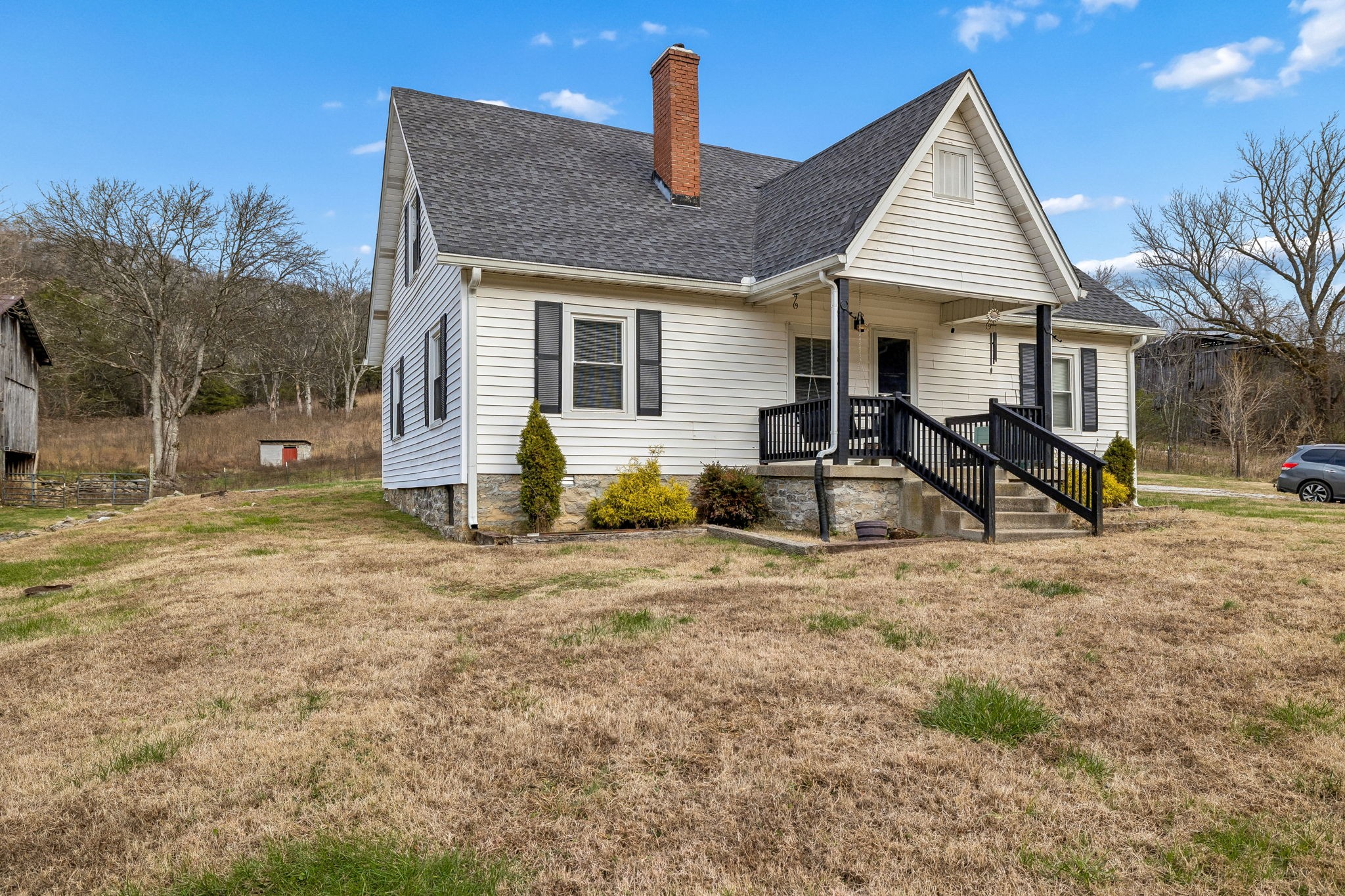 147 Sloan Branch Road Pleasant Shade, TN 37145 - Photo 3 of 53 a front view of a house with garden