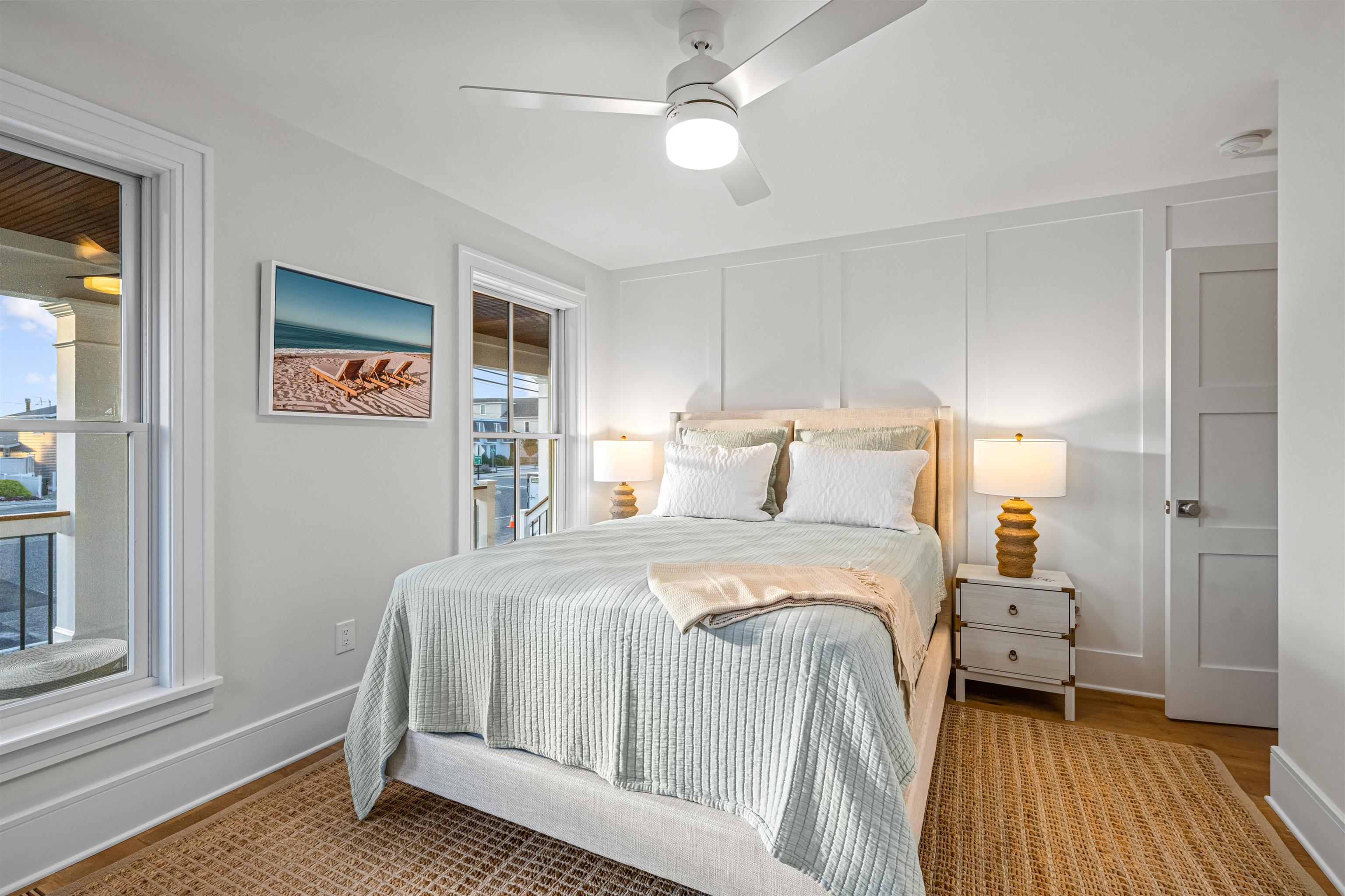 1819 Dune Drive Avalon, NJ 08202 - Photo 11 of 49 a bedroom with a large bed and a window