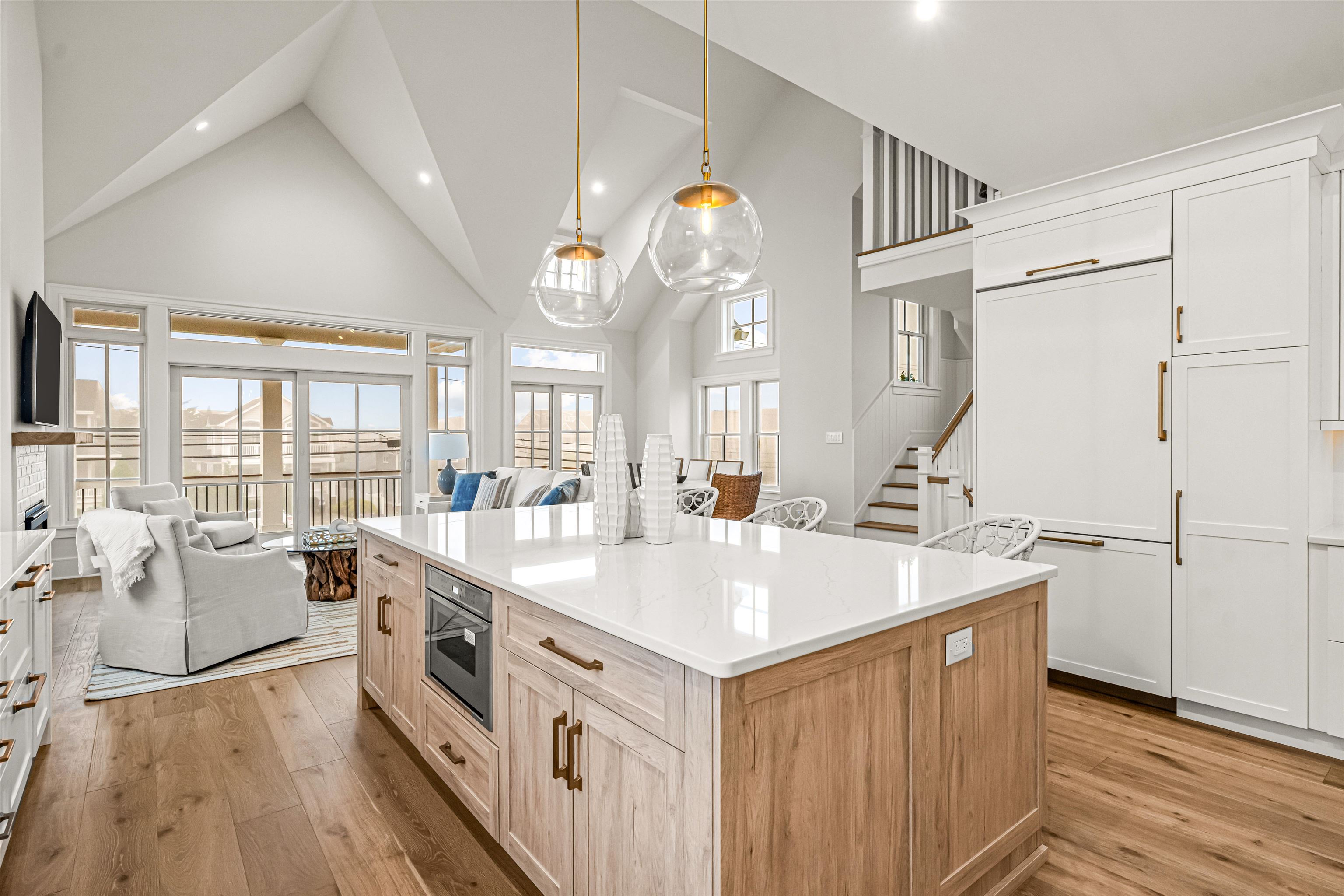 1819 Dune Drive Avalon, NJ 08202 - Photo 29 of 49 a large white kitchen with a large window a sink dishwasher and a stove with wooden floor